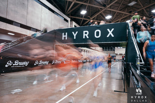 HYROX athletes fueling while running race with Everyday Athlete Energy gel
